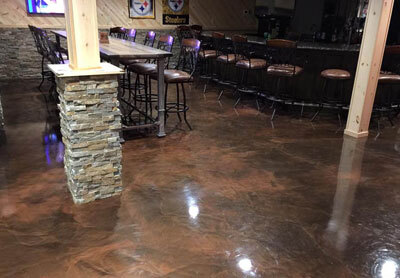 This image shows a commercial space with a brown epoxy floor.