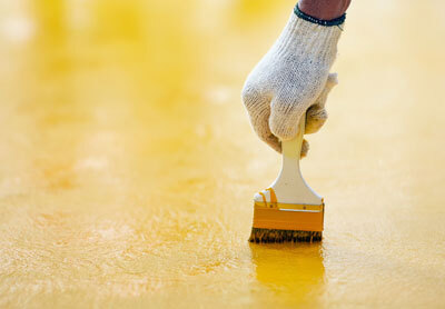This image shows a man brushing the floor.