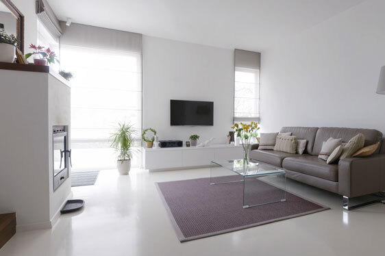 This image shows a living room with an epoxy floor