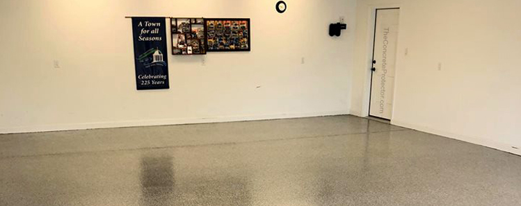 This image shows a garage with a flake epoxy floor.
