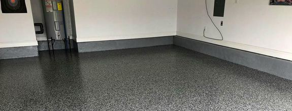 This image shows a garage with a flake epoxy floor.