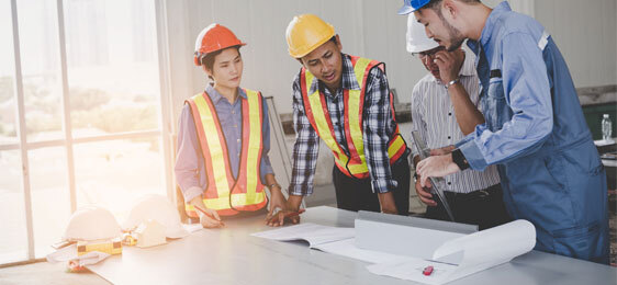 Epoxy Floor Contractors Near Me This image shows flooring contractors planning on what to do with the project.