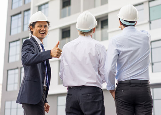 This image shows a man doing a thumbs-up sign.