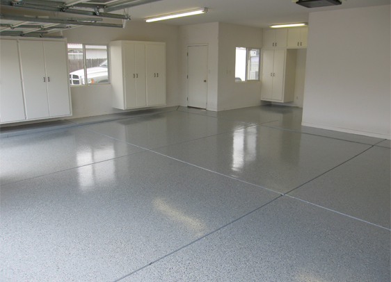 This image shows a garage with a flake epoxy floor.