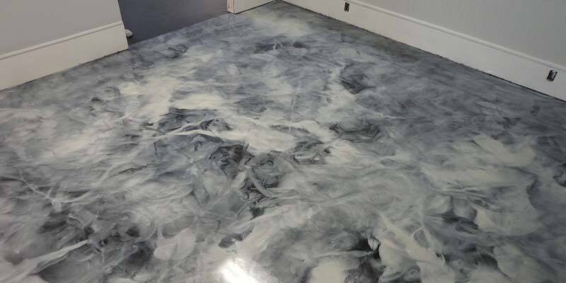 Metallic Epoxy Flooring This image shows a commercial space with a metallic epoxy floor.