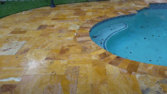 This image shows a pool with a newly resurfaced deck.