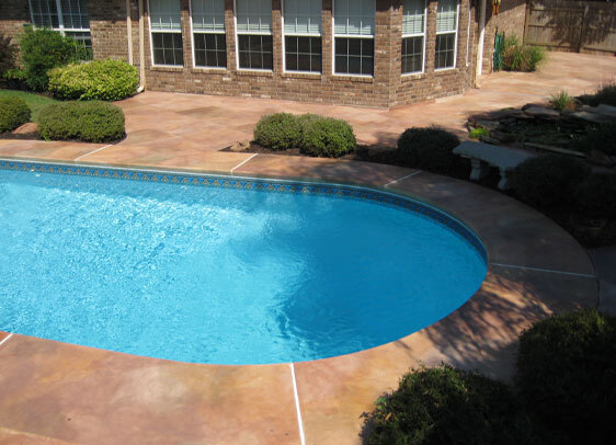 This image shows a pool with a newly resurfaced deck.